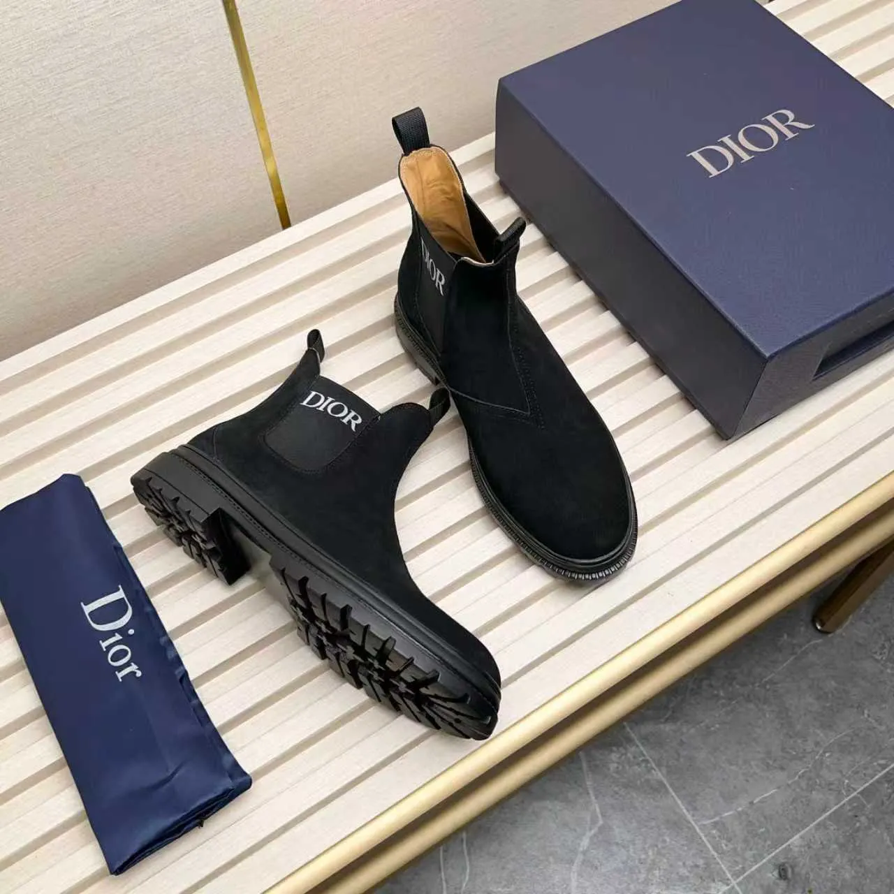 Men's Shoes 💰480 Dior A practical choice that combines protection with classic style. Made from durable Rugged Calf leather, it's tumbled and hand-finished to create a soft suede feel with a rich texture. Elastic side panels and subtle cutouts are inspired by the classic Chelsea boot. Leather upper and lining with Kummel tabs at front and rear, rubber outsole